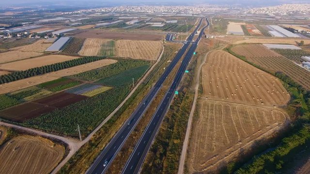 rone over agriculture fields and highway crossing it