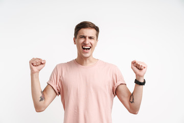 Image of delighted caucasian man screaming and gesturing as winner