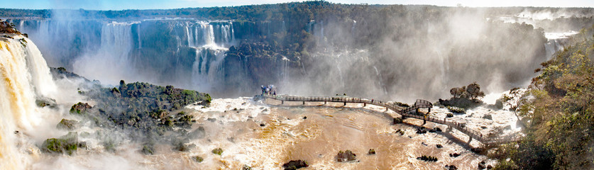 Viewpoint near Devil's throat falls of Iguacu waterfalls, Brazilian side, on a sunny day 