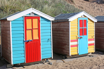 Fototapeta na wymiar Beach huts at Saunton Sands beach, Devon 