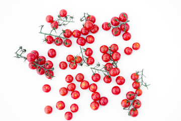 Red ripe cherry tomatoes on a white background.
