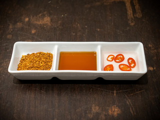 Three kinds of seasoning on a white tray