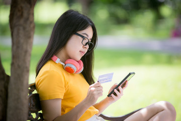 Obraz premium Business women relax and work in the park on vacation 