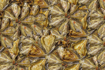 Dried fish well kept. Textured dried fish and  background.