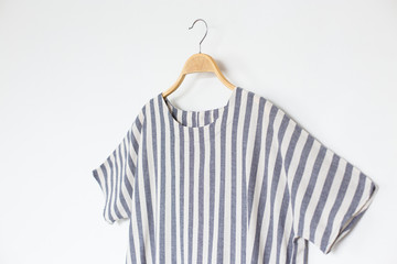 Woman blouse with blue blouse cotton on white background.