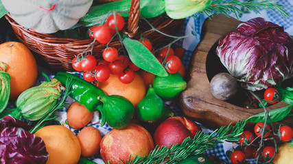 composition of fruit and vegetables on a light blue checked tablecloth