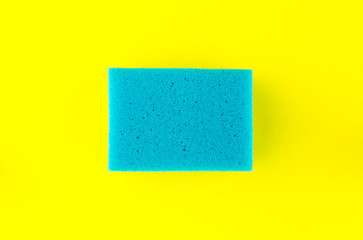 Blue soft sponge on yellow background.