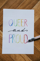 queer and proud written in watercolor