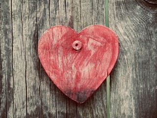 red heart on wooden background
