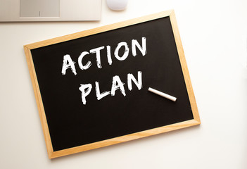 The text is written in chalk on a slate board. business concept