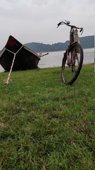 Fototapeta na wymiar bicycle along with boat