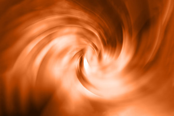 Spiral vortex orange blurred gradient background texture