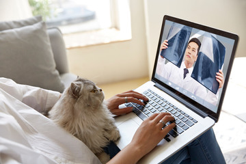 young asian woman receiving an online diagnosis using tele-medicine network