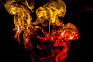 Obraz premium Colored smoke on black background