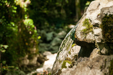 water flowing from a stone