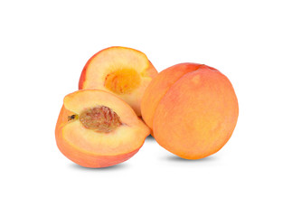 unpeeled whole and half cut fresh peach with seed on white background