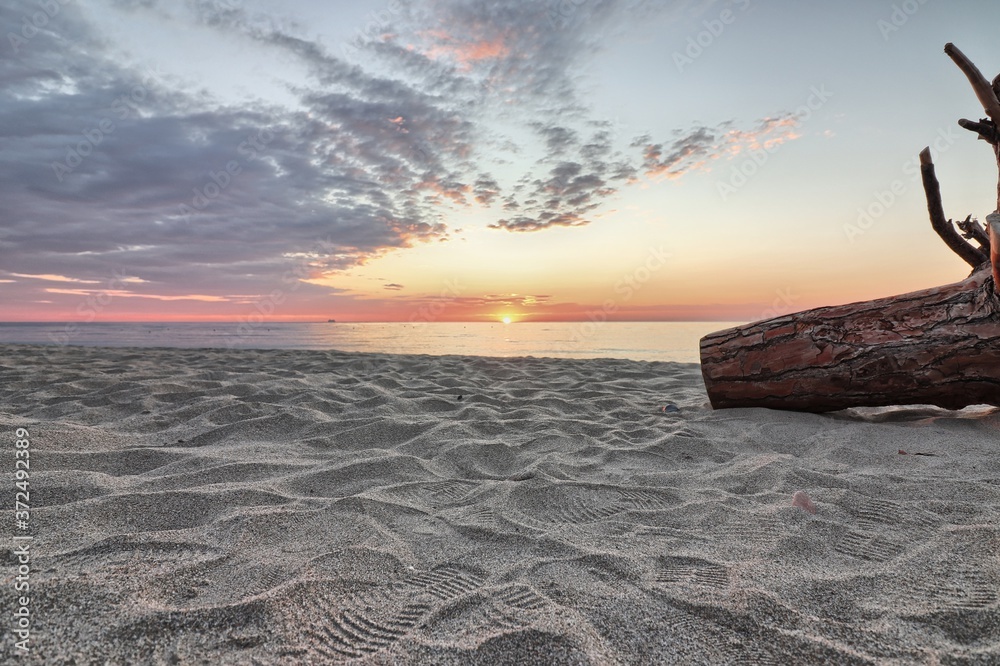 Wall mural sunrise over the sea at the perdepera beach. sardinia, italy