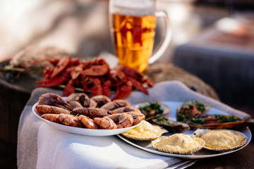 Fototapeta na wymiar Crayfish, beer, shrimp, mussels and scallops for Oktoberfest