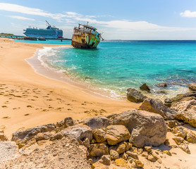 A view of a shipwreck on Governors beach on Grand Turk with the Cruise terminal in the background