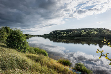 dramatic sky over the river, river landscape,
