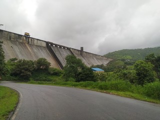 Fototapeta na wymiar Mumbai, Maharashtra/India- August 15 2020: A side view of the big concrete dam built to control flood and generate electricity.