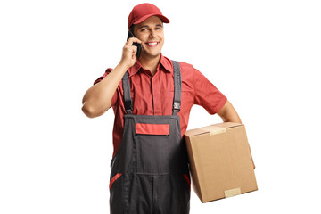 Male worker with a delivery box talking on a mobile phone