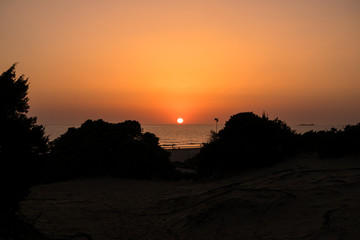 Sunset at La Barrosa beach in Sancti Petri, Cadiz, Spain