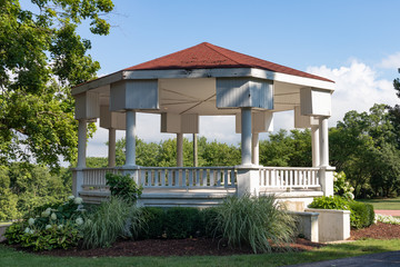 Beautiful Wood Gazebo at Dellwood Park in Lockport Illinois with Green Trees and Shade during the...