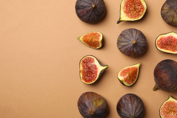 Flat lay with fig fruits on light brown background
