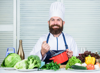 Whipping cream tips and tricks. Use hand whisk. Professional chef hold whisk and pot. Whipping like pro. Man bearded guy in apron whipping eggs or cream. Start slowly whisking whipping beating cream