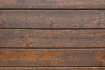 wooden background covered with dark varnish