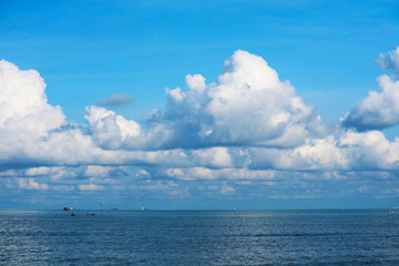 pure clear blue sky huge white gray cloud and sunlight shiny on tropical on sea