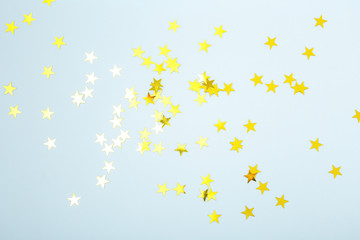 Glitter sparkle star on blue background