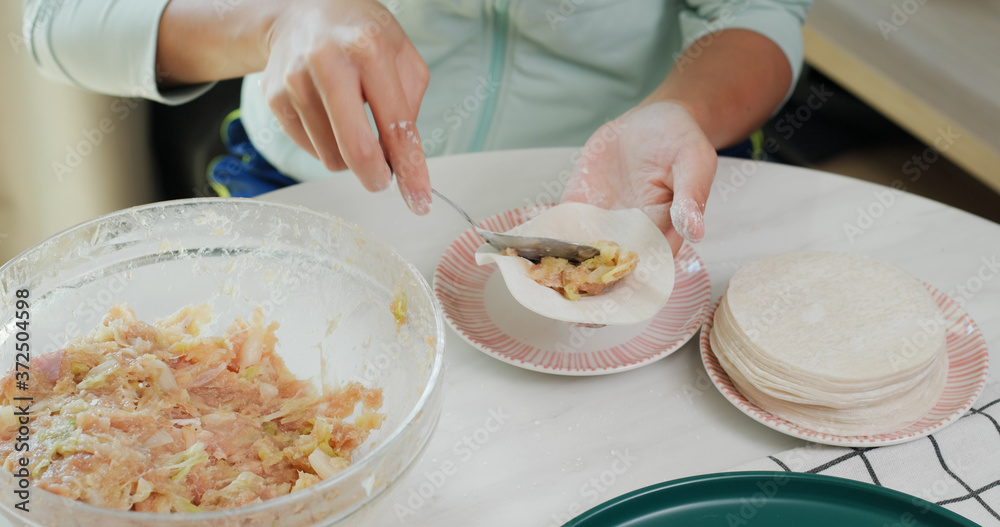 Sticker Woman making meat dumpling at home