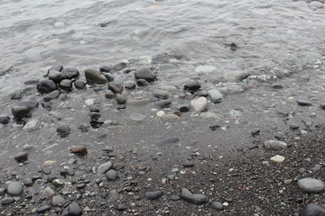 Waves washing over pebbles