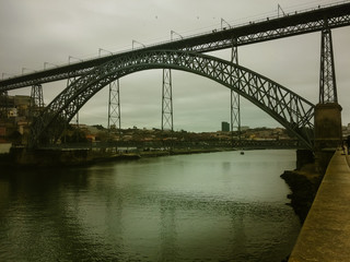Bridge over the river in a gray winter morning.