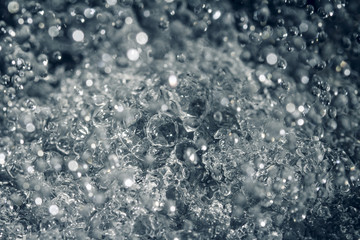 Water drops in motion ,close up. Water wave, motion bubble, abstract background