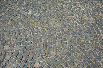 Fototapeta premium Old textured cobblestones in the city