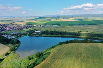 Fototapeta premium Aerial view of a pond in the village of Vrbov in Slovakia