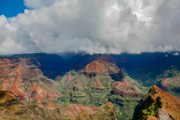 Waimea Canyon, also known as the Grand Canyon of the Pacific, is a large canyon, approximately ten miles long and up to 3,000 feet deep, located on the western side of Kauai, Hawaii