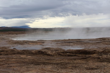 Steam rising from natural hot springs, Iceland