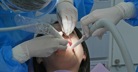 Woman undergo dental scaling treatment