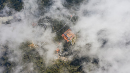 Aerial view architecture of the temple and pagoda on the top of the Fansipan mountain with a beautiful natural scenic of Sapa, Lao Cai, Vietnam