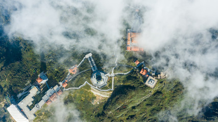Fototapeta premium Aerial view architecture of the temple and pagoda on the top of the Fansipan mountain with a beautiful natural scenic of Sapa, Lao Cai, Vietnam