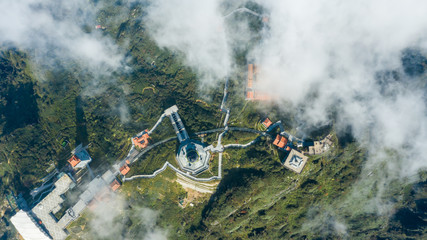 Obraz na płótnie Canvas Aerial view architecture of the temple and pagoda on the top of the Fansipan mountain with a beautiful natural scenic of Sapa, Lao Cai, Vietnam