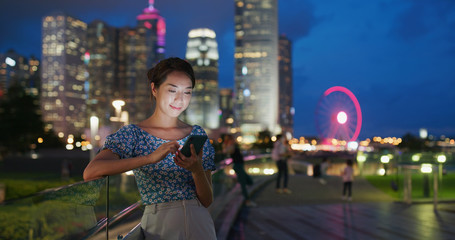 Obraz na płótnie Canvas Woman use cellphone for online at night