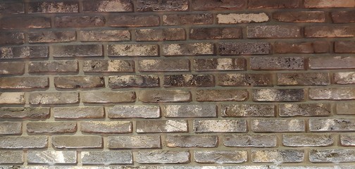Brown-colored spotted block wall_background