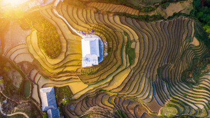 Aerial top view of paddy rice terraces, green agricultural fields in countryside or rice field terraces in Sapa, Lao Cai Province, North West Vietnam in Asia. Nature landscape background.