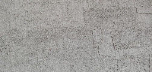 a grey wall with clear brush marks_background