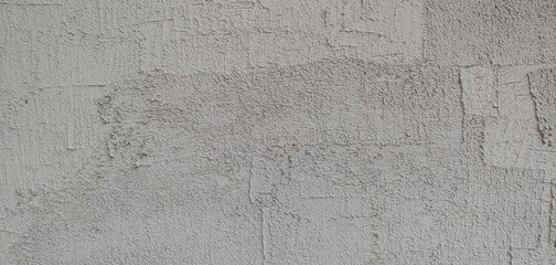 a grey wall with clear brush marks_background